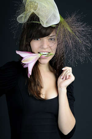 woman biting from flower