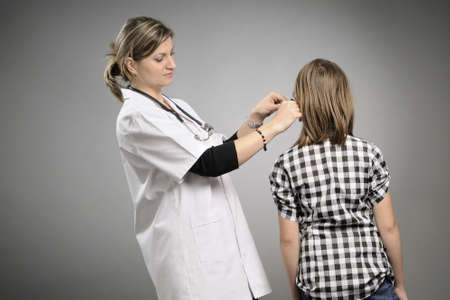 young doctor analyzing ear