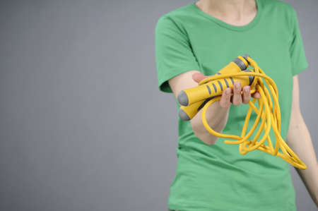 human hand offering jumping ropeの写真素材