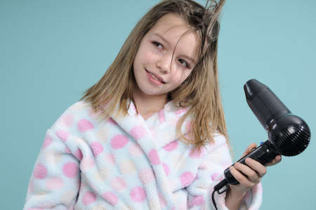 caucasian girl drying hairの写真素材