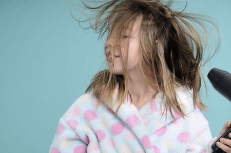 adolescent drying hair の写真素材