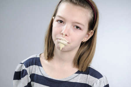 dirty girl cooking in kitchenの写真素材