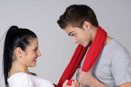 playful young woman having fun with her boyfriendの写真素材