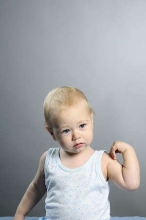 baby boy playing with handsの写真素材