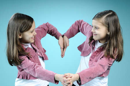 similar children creating heartの写真素材