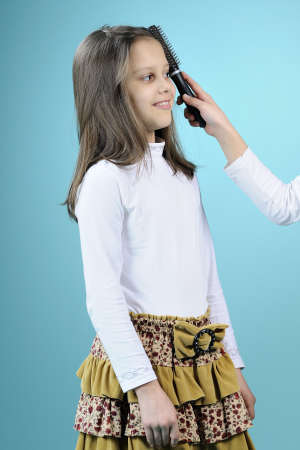 girl brushing hairの写真素材