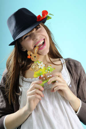 playful girl having fun with easter decorations
