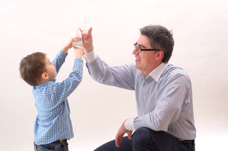 father and his kid celebrating victoryの写真素材