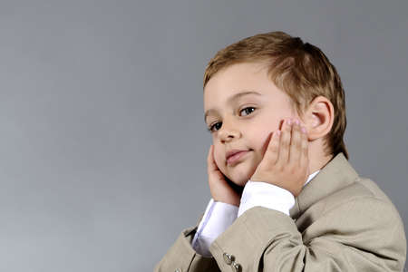 blonde little boy sufferingの写真素材