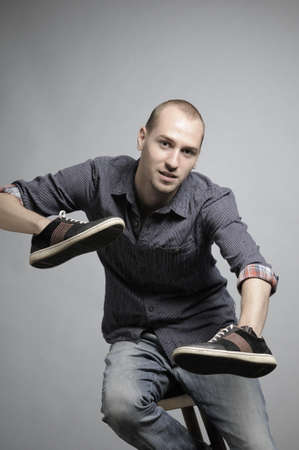 man posing with sneakersの写真素材