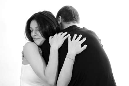 man embracing young woman