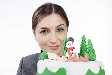 woman celebrating christmas with cake