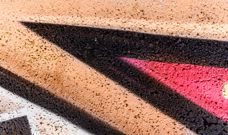 colorful background of graffiti in a city with bright aerosol strips and beautiful colors , urban school wall backdropの写真素材