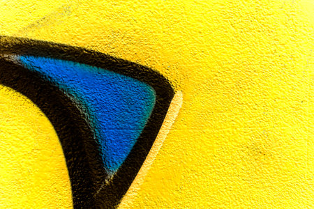 Colorful aerosol street wall background. Urban modern art texture. Wallpaper design backdrop pattern. Painted city wall close up.の写真素材