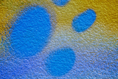 colorful background of graffiti in a city with bright aerosol strips and beautiful colors , urban school wall backdropの写真素材