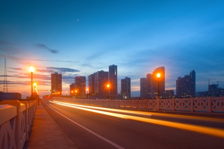 City of Miami Florida, colorful sunset panorama of downtown business and residential buildings and bridgeのeditorial素材