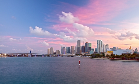 City of Miami Florida, colorful sunset panorama of downtown business and residential buildings and bridgeのeditorial素材
