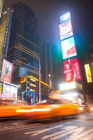 New York City, USA- MAY 28, 2013  Times Square, New York famous downtown Manhattan at night with moving yellow taxis and colorful advertisements のeditorial素材
