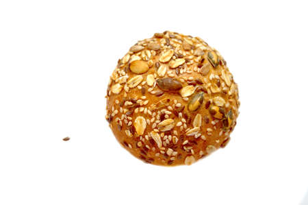 Little bread bun, decorated with grains and cereals on isolatedの写真素材