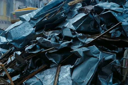Bunch of sheet metal, metal scrap, dismantled pieces sheet metal of old roof, ecology problemsの写真素材