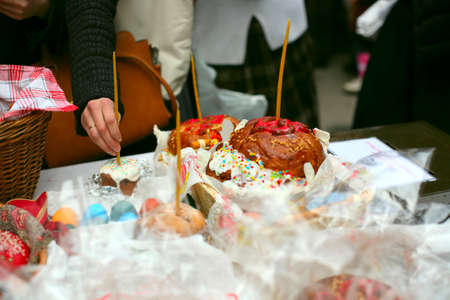 People cooked and brought to consecrate Easter cakes and eggs in the Church, Orthodox russian traditionの写真素材