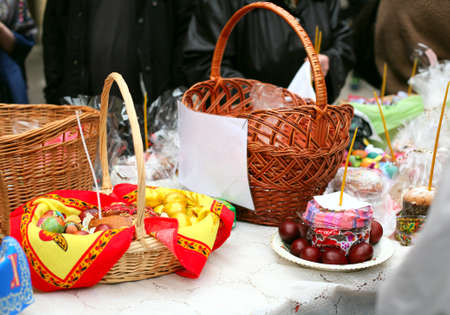 People come to church consecrate Easter cakes and eggs, lit church candles, inserted into the cakesの写真素材