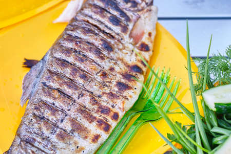 Fried trout grill on the table close upの写真素材
