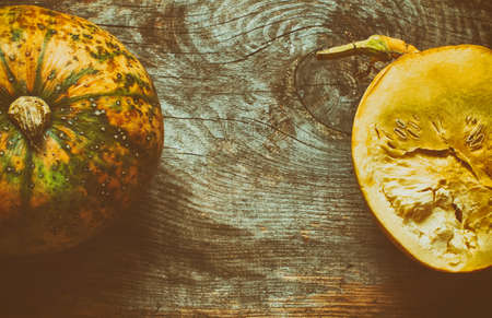 Vintage wooden background with pumpkin with copy space from aboveの写真素材