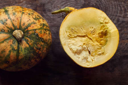 Vintage wooden background with pumpkin from aboveの写真素材