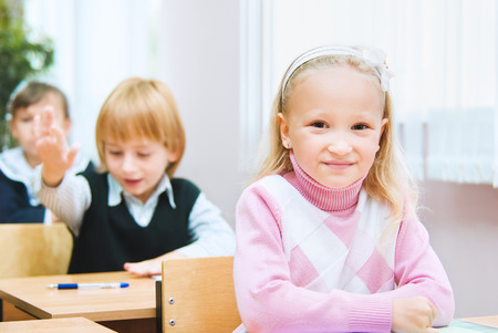 School girl sits at the deskの写真素材