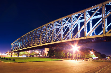 Illuminated bridge in the city of Novosibirsk. Uban night landscape
