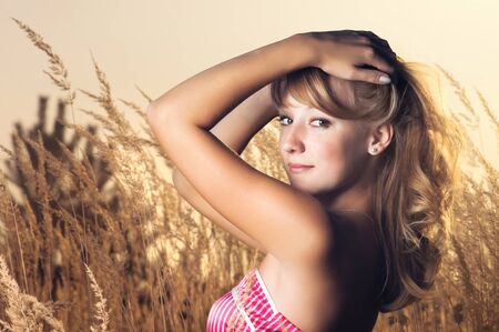 Portrait of the young beautiful smiling woman outdoorsの写真素材