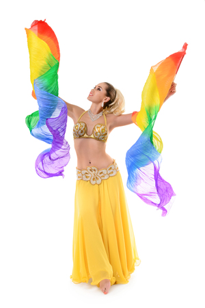 Beautiful belly dancer with multicolor shawl isolated on white backgroundの写真素材