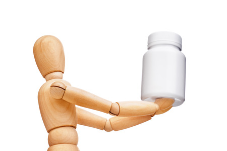 Wooden man hold a medical containerの写真素材