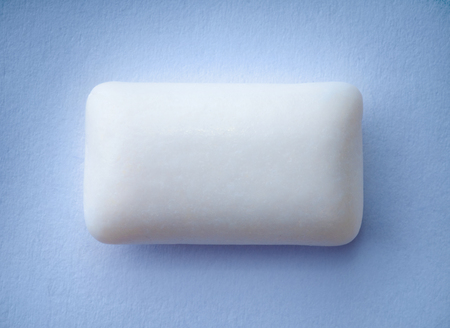 Chewing gum on blue backgroundの写真素材