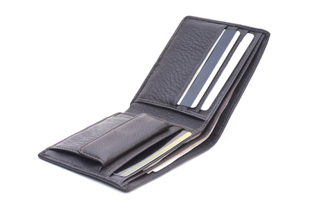 Open brown leather wallet with moneyの写真素材