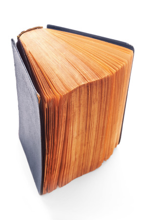 Old closed book on white backgroundの写真素材