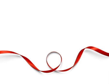 Curly red ribbon isolated on white backgroundの写真素材