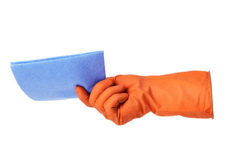 Hand with orange rubber glove holds blue cloth isolated on white backgroundの写真素材