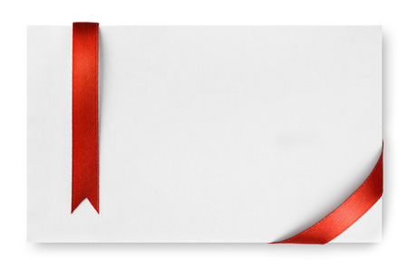 Red silk ribbon on empty paper cardの写真素材