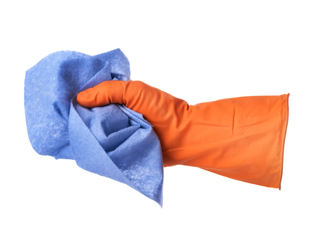 Hand with orange rubber glove holds blue cloth isolated on white backgroundの写真素材