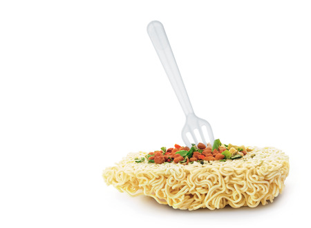 Uncooked fast food vermicelli with forkの写真素材
