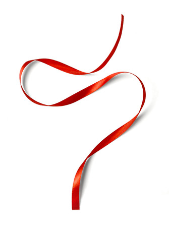 Curly red ribbon isolated on white backgroundの写真素材