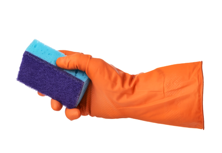 Hand with orange rubber glove holds blue sponge isolated on white backgroundの写真素材