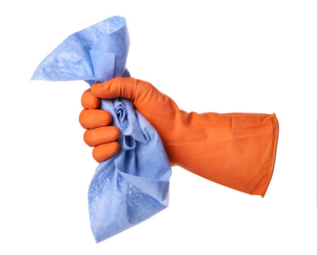 Hand with orange rubber glove holds blue cloth isolated on white backgroundの写真素材