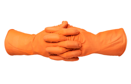 Two hands with orange rubber glove isolated on white backgroundの写真素材