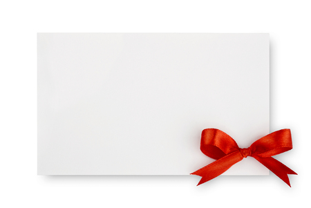 Red silk bow on empty paper card isolated on white backgroundの写真素材