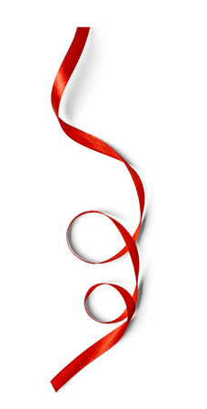 Curly red ribbon isolated on white backgroundの写真素材