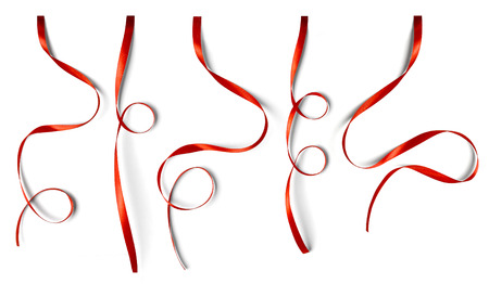 Set of curly red ribbons isolated on white backgroundの写真素材