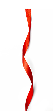 Curly red ribbon isolated on white backgroundの写真素材